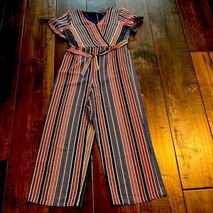 Cute jumpsuit with bow! Never been worn.